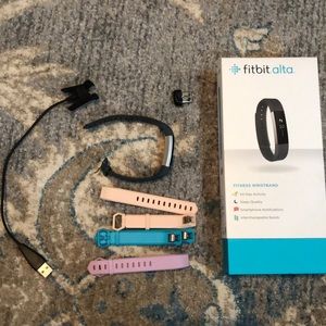 Fitbit Alta with turquoise aqua pink, purple bands